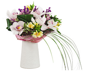 Image showing Bouquet from orchids in white vase isolated on white background.
