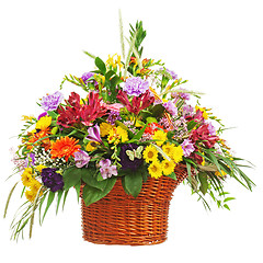 Image showing Flower bouquet arrangement centerpiece in wicker basket isolated