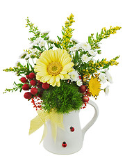 Image showing Colorful bouquet from gerberas in vase isolated on white backgro