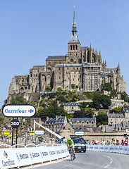 Image showing Cycling in Front of Le Mont Saint Michel