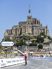 Image showing Cycling in Front of Le Mont Saint Michel