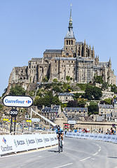 Image showing Cycling in Front of Le Mont Saint Michel