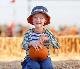 Image showing kid at pumpkin patch