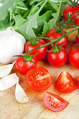 Image showing fresh tomatoes, rucola and garlic
