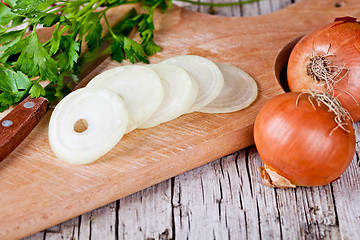 Image showing fresh onions, knife and parsley 