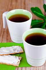 Image showing two cups of tea and crackers with cream cheese 