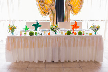 Image showing tables decorated with flowers and fruit