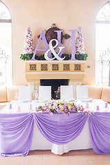 Image showing Bride and groom's table decorated with flowers