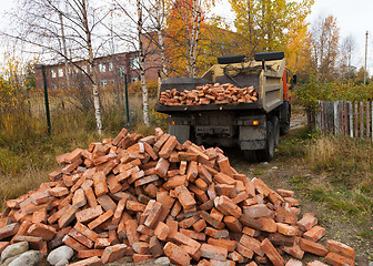 Image showing Dump truck downloading red blocks 