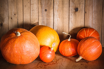 Image showing Pumpkins on grunge wooden backdrop background