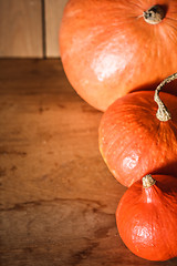 Image showing Pumpkins on grunge wooden backdrop background