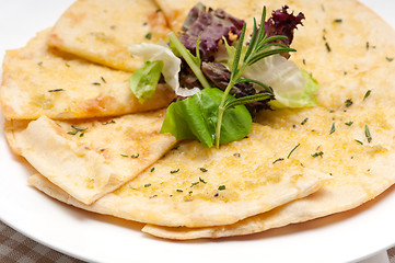 Image showing garlic pita bread pizza with salad on top