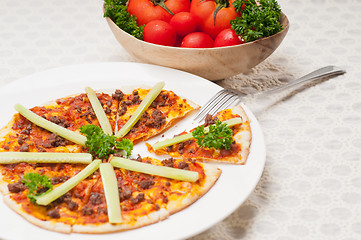 Image showing Turkish beef pizza with cucumber on top