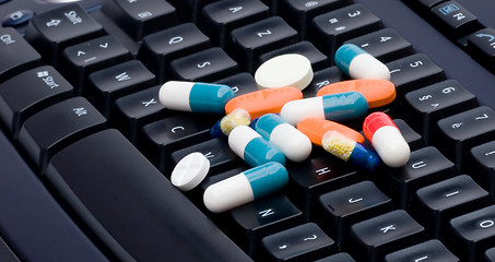 Image showing Keyboard and pills