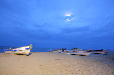 Image showing Boats on the beach starting the sunset