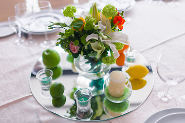 Image showing tables decorated with flowers and fruit