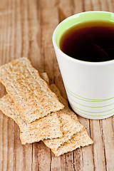 Image showing cup of tea and crackers