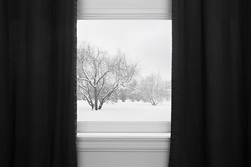Image showing Winter landscape behind black curtains