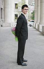 Image showing Young man with flowers
