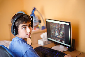 Image showing Boy using computer at home