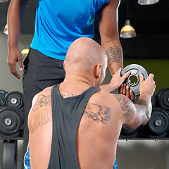 Image showing Man with trainer in gym