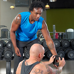 Image showing Man with trainer in gym