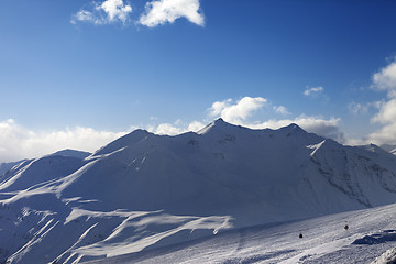 Image showing View on ski slope and beautiful mountains in evening