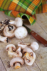 Image showing  fresh champignons and old knife