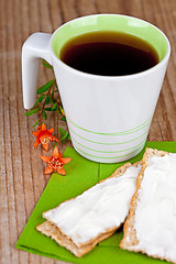 Image showing cup of tea and crackers with cream 