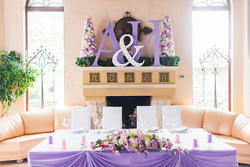 Image showing Bride and groom's table decorated with flowers