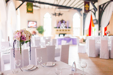 Image showing Tables decorated with flowers