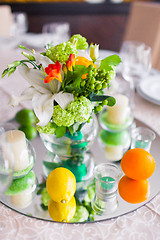 Image showing tables decorated with flowers and fruit