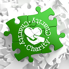 Image showing Charity Concept on Green Puzzle Pieces.