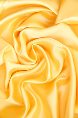 Image showing Smooth elegant golden silk as background 