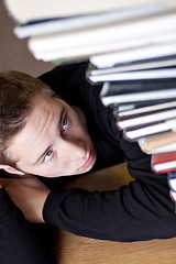 Image showing Student Looking at Homework
