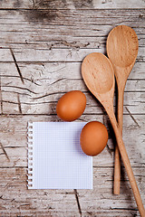 Image showing eggs, spoons and blank paper