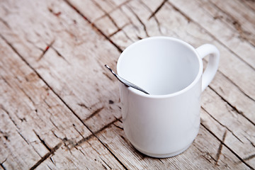 Image showing empty white cup and spoon 