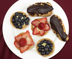 Image showing Fruit tarts and eclairs