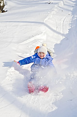 Image showing Little girl on a sled in the winter