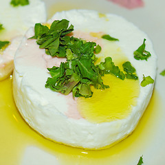 Image showing Tomino cheese with rucola and olive oil