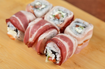 Image showing Sushi roll with bacon