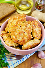 Image showing Fritters chicken with bread and spices on board