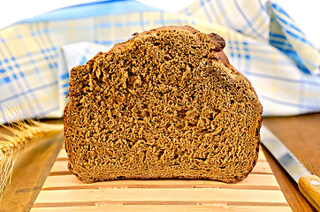 Image showing Rye homemade bread on a wooden stand