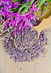 Image showing Herbal tea from fireweed fresh and dry on a wooden spoon