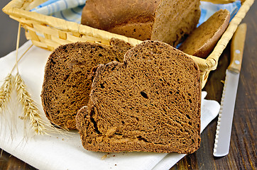 Image showing Rye homemade bread with ears on board