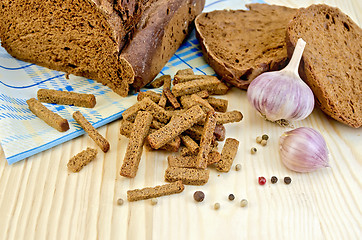 Image showing Rye homemade bread with croutons on the board