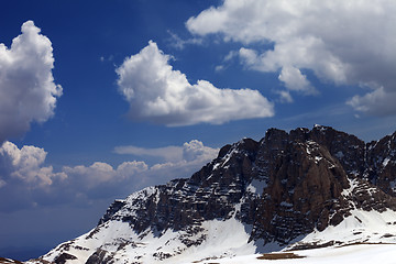 Image showing Blue sky with clouds and snow rocks