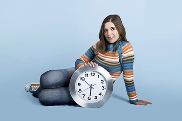 Image showing Woman with a clock