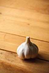 Image showing Raw garlic on wooden background