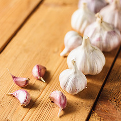 Image showing Raw garlic on wooden background